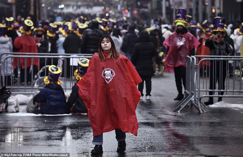 A woman in a red poncho was seen as the crowd began to arrive for the evening's celebrations.