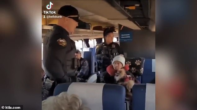 Police confronting the sisters on the Amtrak train on December 21