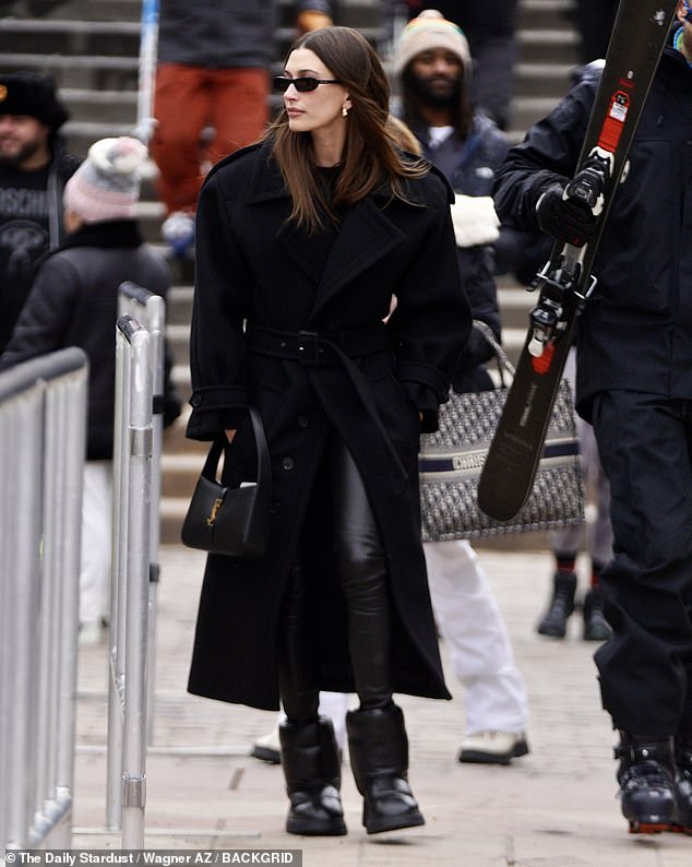 Manhattan Chic: Rocking a belted black trench coat, the supermodel brought a bit of Manhattan to Aspen while looking like the ultimate New Yorker