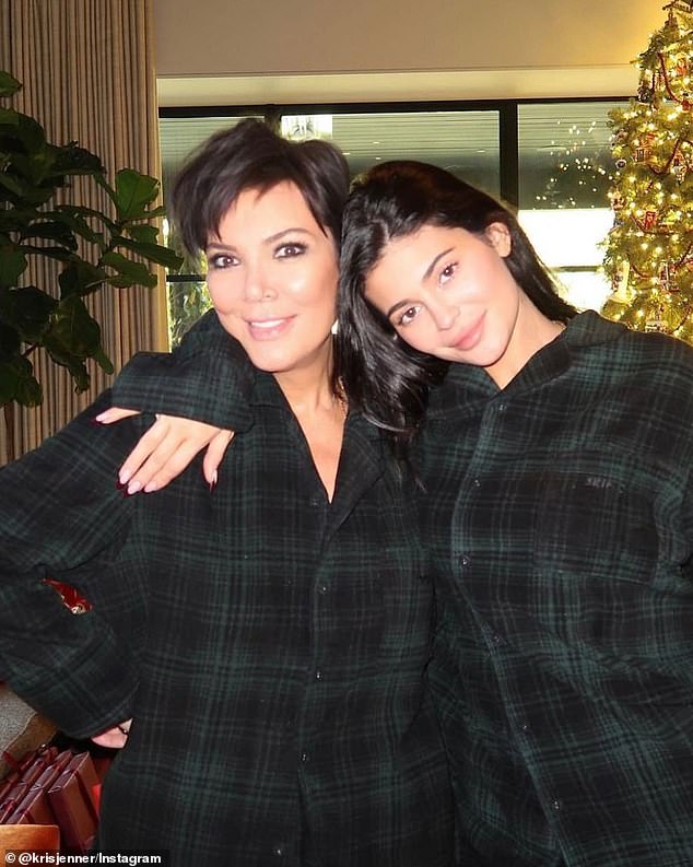 Matching pajamas: The 67-year-old mom began her post with a photo of herself and her youngest daughter, Kylie, in matching green flannel pajamas