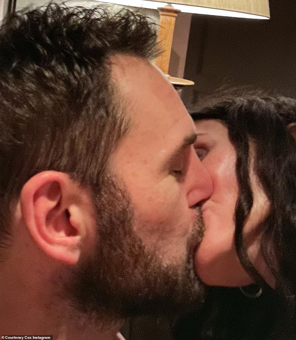 Celebrate: The happy couple kissed to ring in the new year