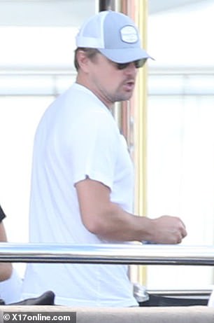 Party boat: DiCaprio kept a low profile under a gray and white hat during a getaway to St. Bart with some friends