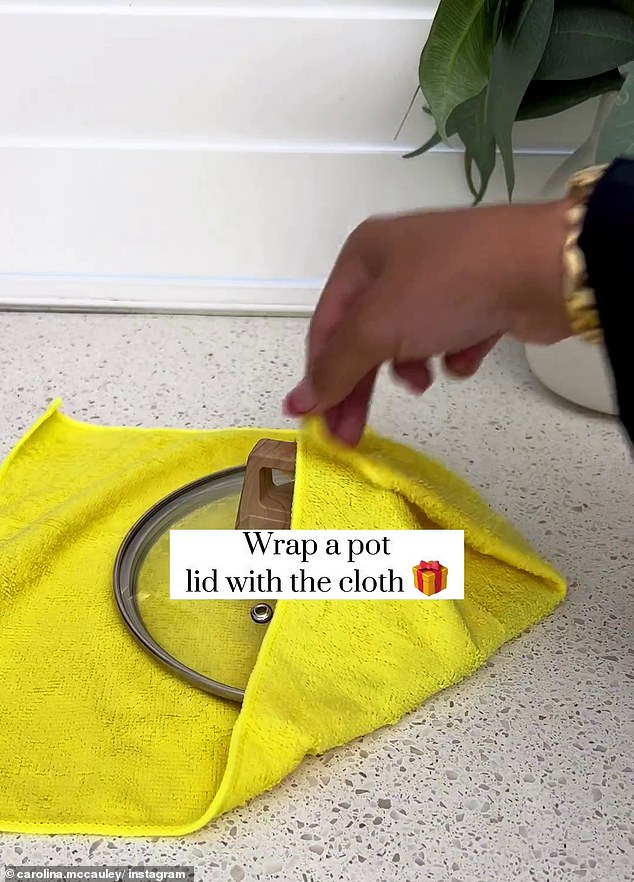 Then, wrap a pot lid inside the cloth so you have a handle to hold onto for efficient cleaning.