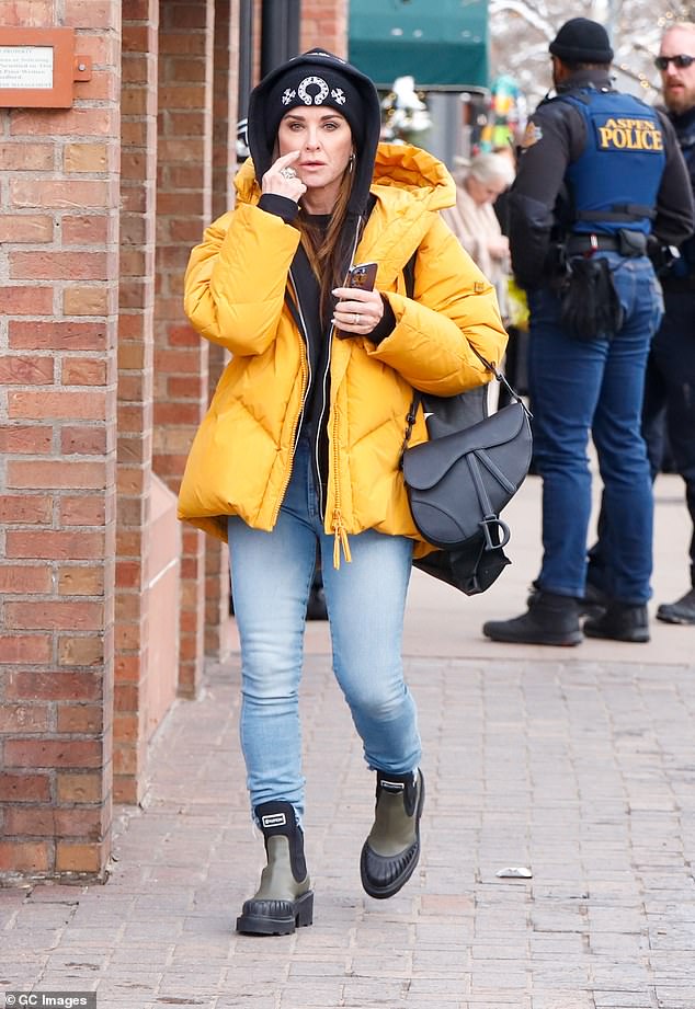 Fashionista: A day earlier, the Bravo TV personality made another fashion statement when she hit the streets of Aspen in a bright orange coat.