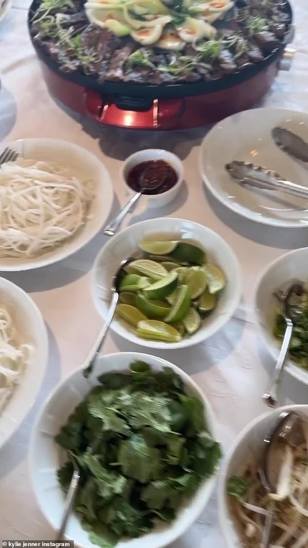 Tasty meals: Kylie shared a quick video showing a buffet full of meat and scrumptious sides being set out on a table covered with a tablecloth