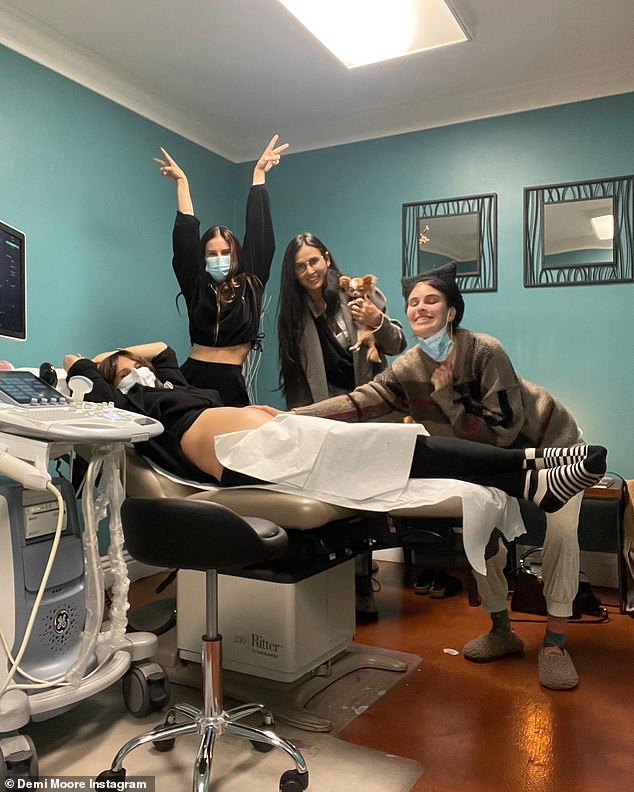 Gift of life: Demi Moore posted a photo of her daughter during a checkup with her doctor that was attended by all of her daughters, including Scout and Tallulah