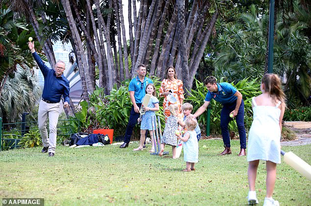 David's wife, Candice (pictured), was also in on the game, looking stunning in a burnt orange maxi dress.