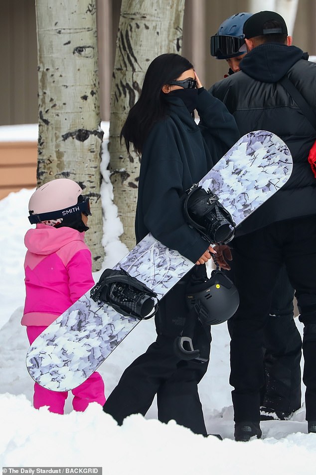 Doting mom: Jenner kept an eye on Stormi, who was as stylish as her mom in a hot pink snowsuit