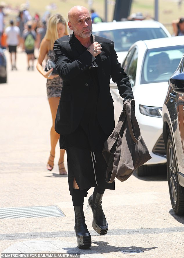 Restaurateur Maurice Terzini (pictured), owner of Icebergs, rocked an edgy look in latex platform boots and clear Perspex heels.