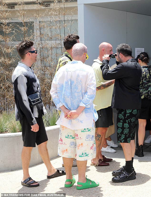 Designer Henry Holland (far left) was also in attendance, looking great as always in a black ensemble with a latex crossbody bag.