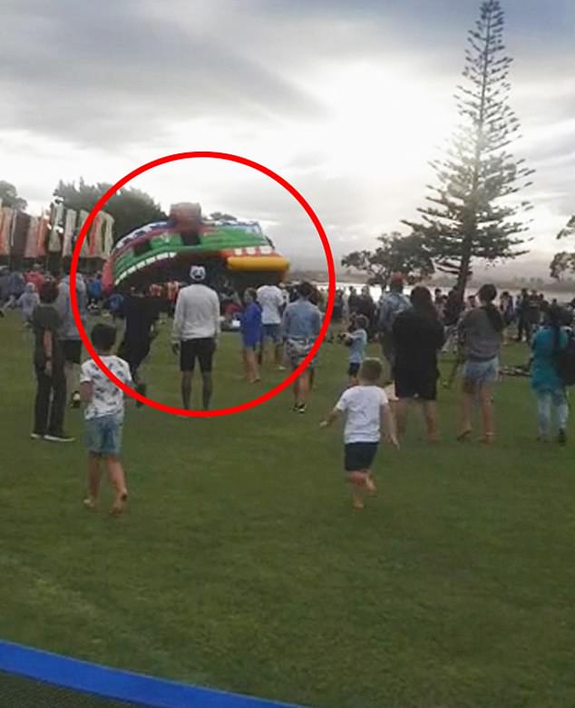 Strong gusts of wind at a community celebration in Tauranga, New Zealand lifted a jumping castle (pictured) into the air