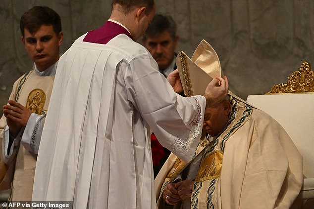 Pope Francis sits as he prepares to preside over the service marking the World Day of Peace in St. Peter's Basilica, in the Vatican, on January 1, 2023. - Pope Francis will address the Catholic faithful on January 1 January 2023, at the Vatican, the day after the death of his predecessor Benedict XVI at the age of 95