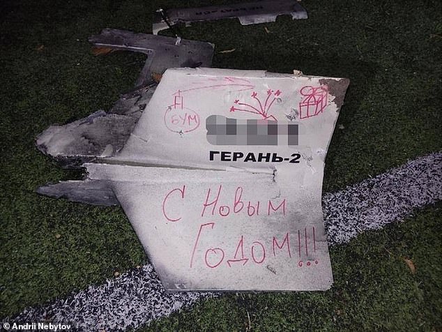 A Happy New Year message is written in Russian on what appears to be a part of an Iranian-made Shahed kamikaze drone fired at Kyiv overnight.