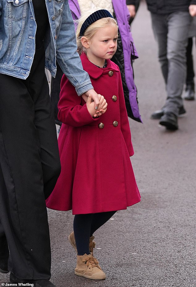 Little Lena looked adorable in a red coat as she attended the races with her parents on New Year's Day.