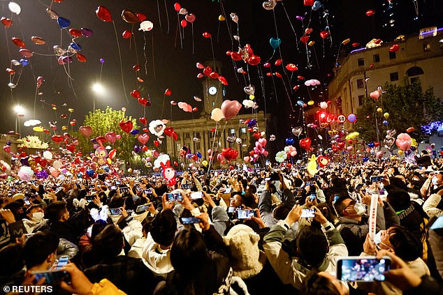 People release balloons as they gather to celebrate New Year's Eve, amid the coronavirus disease (COVID-19) outbreak, in Wuhan, Hubei province, China, January 1, 2023.