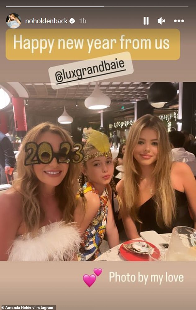 2023!  The sultry bikini snaps come after Amanda celebrated New Year's Eve in style as she joined her daughters and her husband Chris Hughes on a vacation to remember.