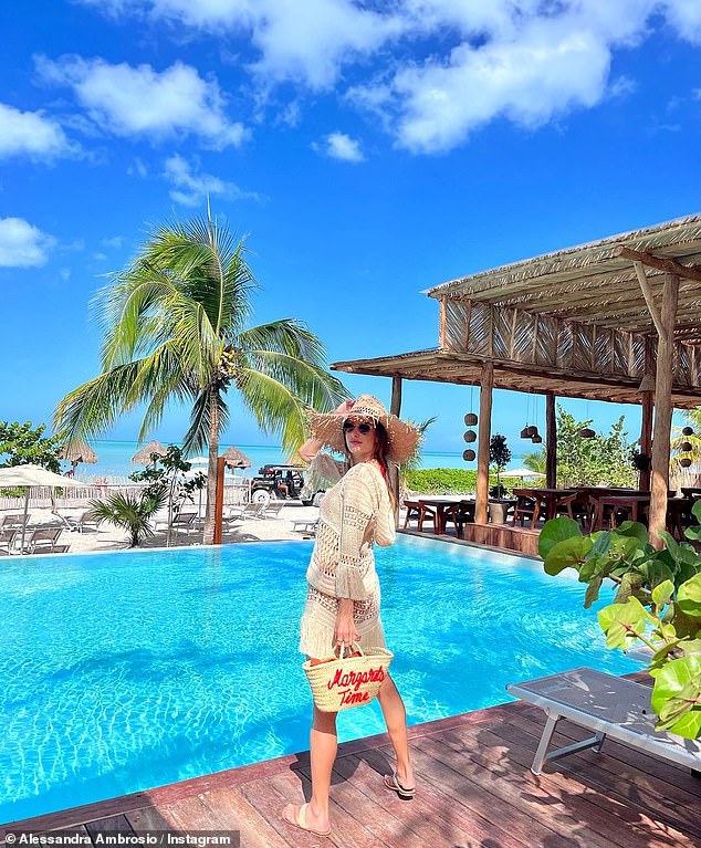 Paradise: Behind the Brazilian superstar was a spectacularly blue pool and a palm tree