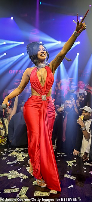 The Bronx-born 30-year-old flaunted her surgically enhanced cleavage in a low-cut red dress by stylist Kollin Carter.