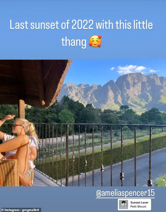 Looking dapper in a white blouse and shorts, Greg also took a photo of his girlfriend against the backdrop of a beautiful mountain.