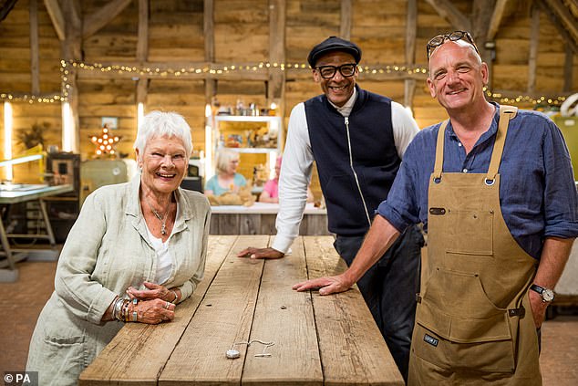 The veteran actress had Michael's watch repaired and engraved with his initials as part of a live session of The Repair Shop at the 2022 Edinburgh TV Festival (L-R: Dame Judi seen with Jay and horologist Steve Fletcher)