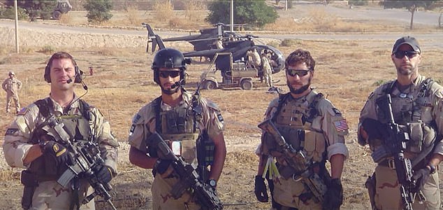 Holland, pictured in 2003 with other Delta Force members in Iraq, revealed that Hussein was armed and that the weapon, a Glock-15, is now in the possession of former President George W. Bush.