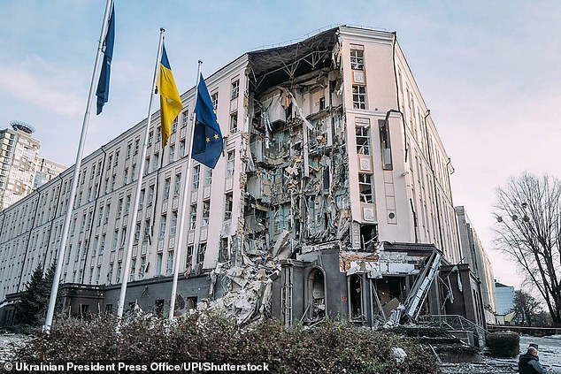 The missiles have reached Kyiv, the city's mayor said, as emergency services attended the scene.  Pictured: A missile attack on a hotel building in Kyiv yesterday that killed one person and injured 20