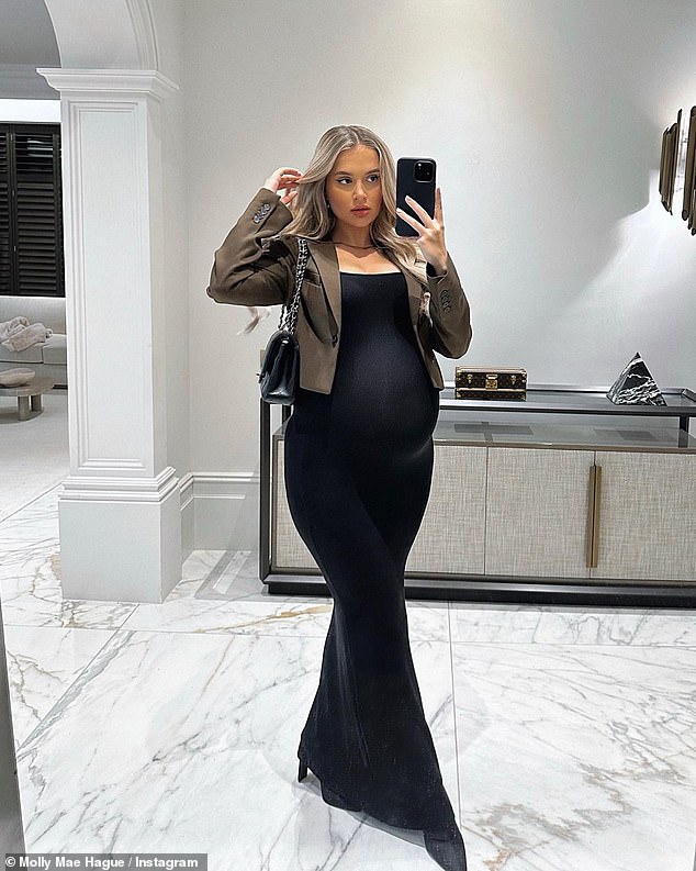 Stunning: The reality star, 23, looked amazing as she showed off her growing baby bump in a figure-hugging floor-length black dress