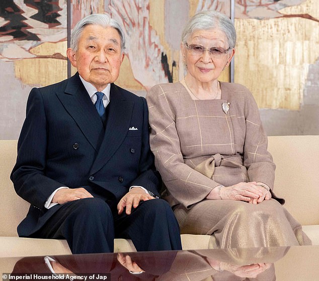 Emperor Naruhito's father, Emperor Emeritus Akihito, 89, also appeared in the festive pictures, looking refined as always in a deep navy double-breasted suit.