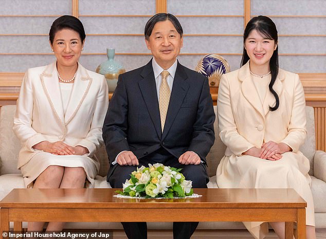 Smiling alongside her 62-year-old husband, the empress, 59, pinned her brown locks up in an elegant style, looking gorgeous with a minimal layer of makeup and matching pearl jewelry.