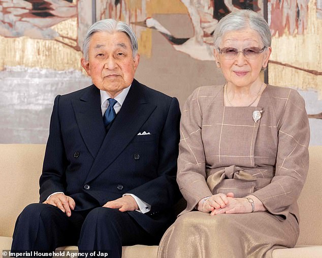 Emperor Emeritus Akihito was photographed with his wife Empress Emeritus Michiko, 88, who wore a glamorous ensemble in muted tones, featuring a square-neck top and flowing skirt.