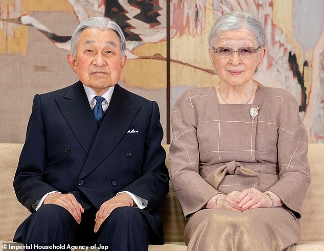 The couple appeared to be in good spirits as they smiled for festive family portraits at the Akasaka Imperial Estate residence in Tokyo.