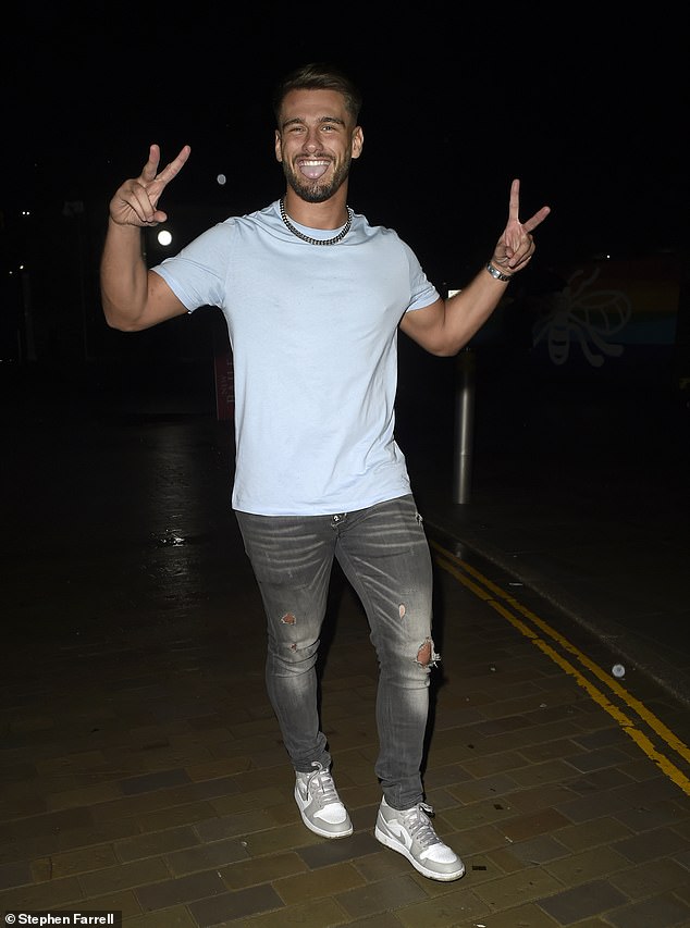 Looking good: Meanwhile, Jacques wore a pale blue T-shirt with a pair of ripped gray jeans and a chunky silver chain necklace