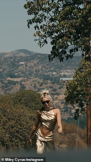 Messy top-bun: In a second sneak peek, Miley (née Destiny) could be seen strutting through an LA County canyon