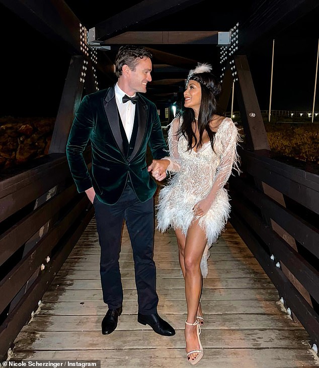 Lovebirds: The Pussycat Doll, 44, took to Instagram on New Year's Day to share a slew of love-struck snaps of the couple dressed to the nines.