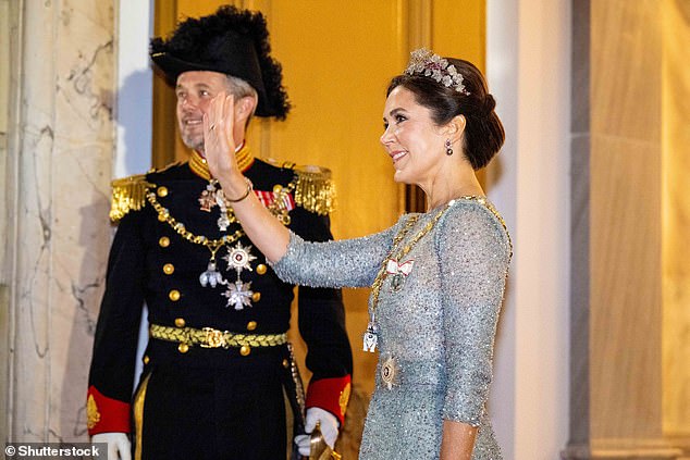 Mary looked resplendent in a blue sequined gown, tiara and state regalia for the annual New Year's Eve dinner and government table at Christian VII Palace in Amalienborg.