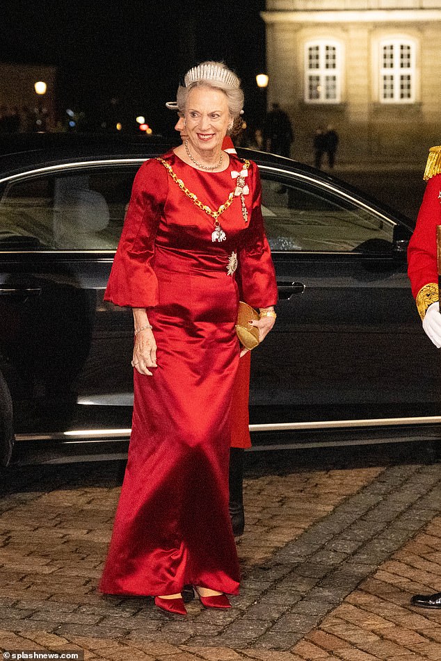 Meanwhile, Queen Margrethe opted for red and satin shoes to match her stunning gown (pictured on New Year's Eve).