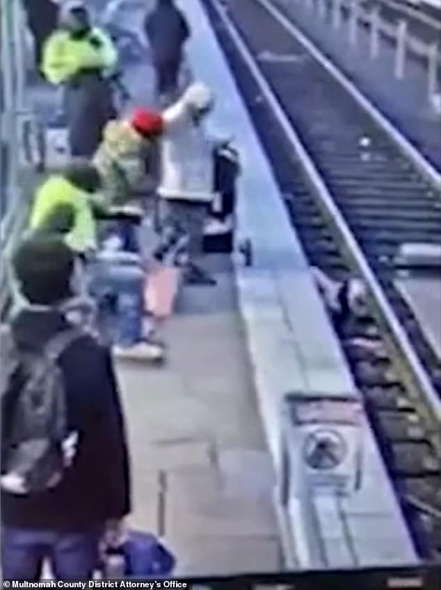 The girl, who was wearing a pink coat, was waiting in line with her mother when surveillance footage captured someone in a red hat, allegedly Workman, shoving her face-first into the metal railing.