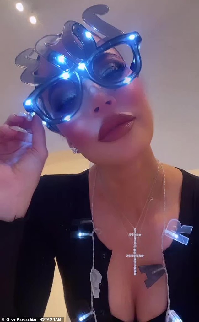 New Year's flare: Khloe Kardashian ringed in the new year with a short boomerang wearing a pair of blue 2023 glasses on New Year's Eve, Saturday