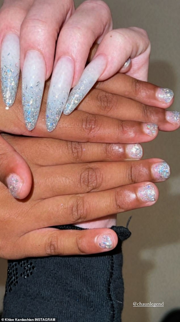 And daughter too: Khloe shared a picture of her long nails next to daughter True's nails sporting the same glittery polish