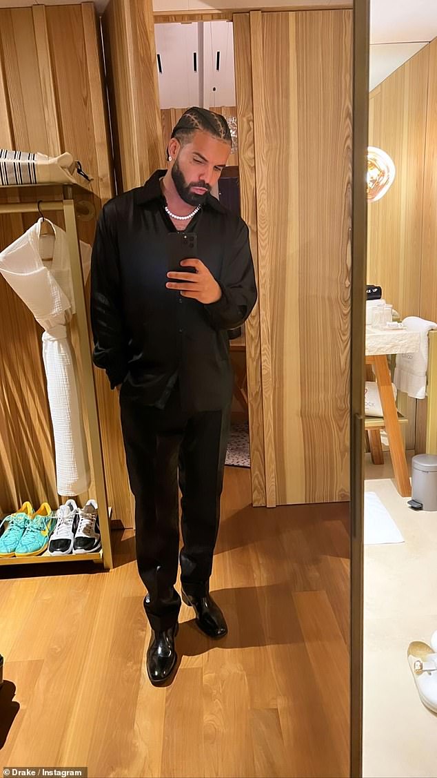 Drake was also seen in a full body selfie in which he donned a black button up top with black slacks and dress shoes.