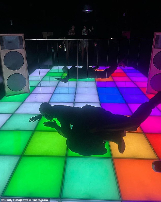 Performance: Emily was joined by other famous faces, including acclaimed singer-songwriter Moses Sumney, who posed sprawled across the colored tiles of the dance floor.