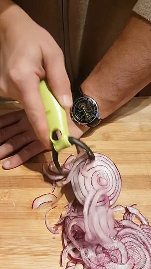 Poke the bottom of the onion with a fork facing down, secure it with the palm of your hand and with your other hand run the peeler 'back and forth' over the top of the onion creating perfect slices.