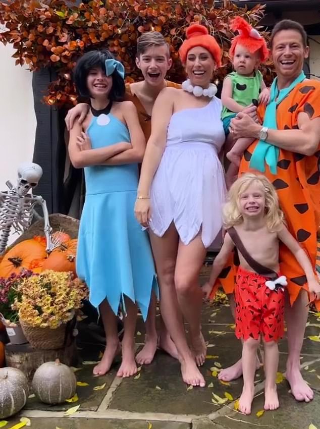 Sensational: For Halloween, Stacey went all out with her brood as they transformed into the iconic cartoon family, The Flintstones.