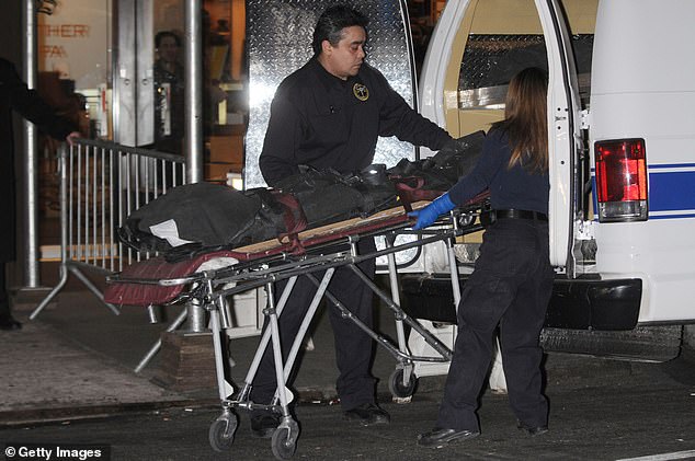 A stretcher carrying the body of Jude Mirra is seen being taken out of the hotel in February 2010.