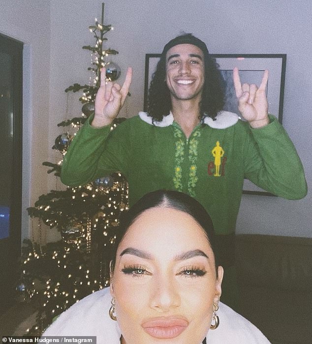 Cute couple: Hudgens shared a Christmas photo with her boyfriend Tucker on Thursday