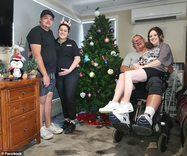 John Van de Putte then posted a photo of his family with the Lily and Gabby bauble in prime position as the star on top of their Christmas tree.