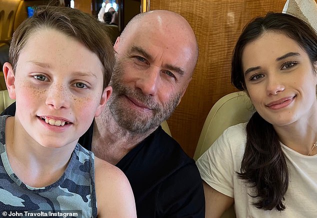 Happy family: Travolta is father to daughter Ella Bleu and son Benjamin, 11 (pictured)