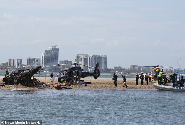 Marine Rescue ran onto the sandbank after two helicopters (pictured) collided on Monday