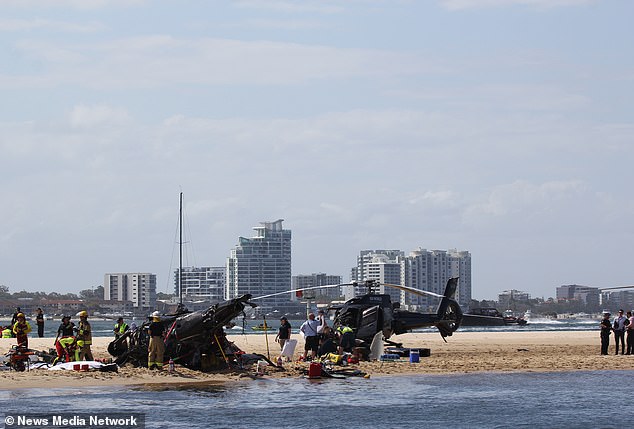 The crash between two helicopters (pictured) occurred at around 2pm Queensland time.