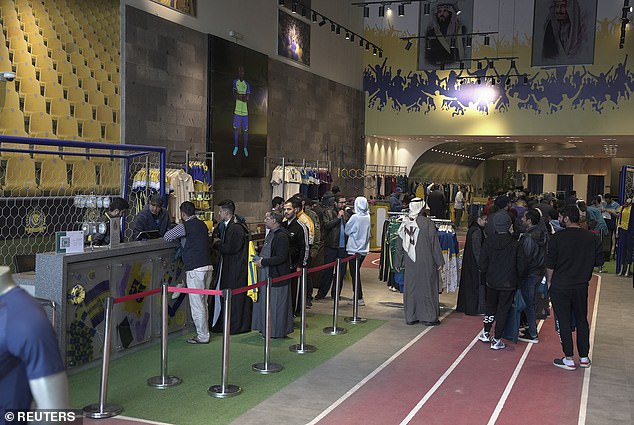 Excited Al Nassr fans queue up at the club shop to collect the 37-year-old's famous number 7 shirt.